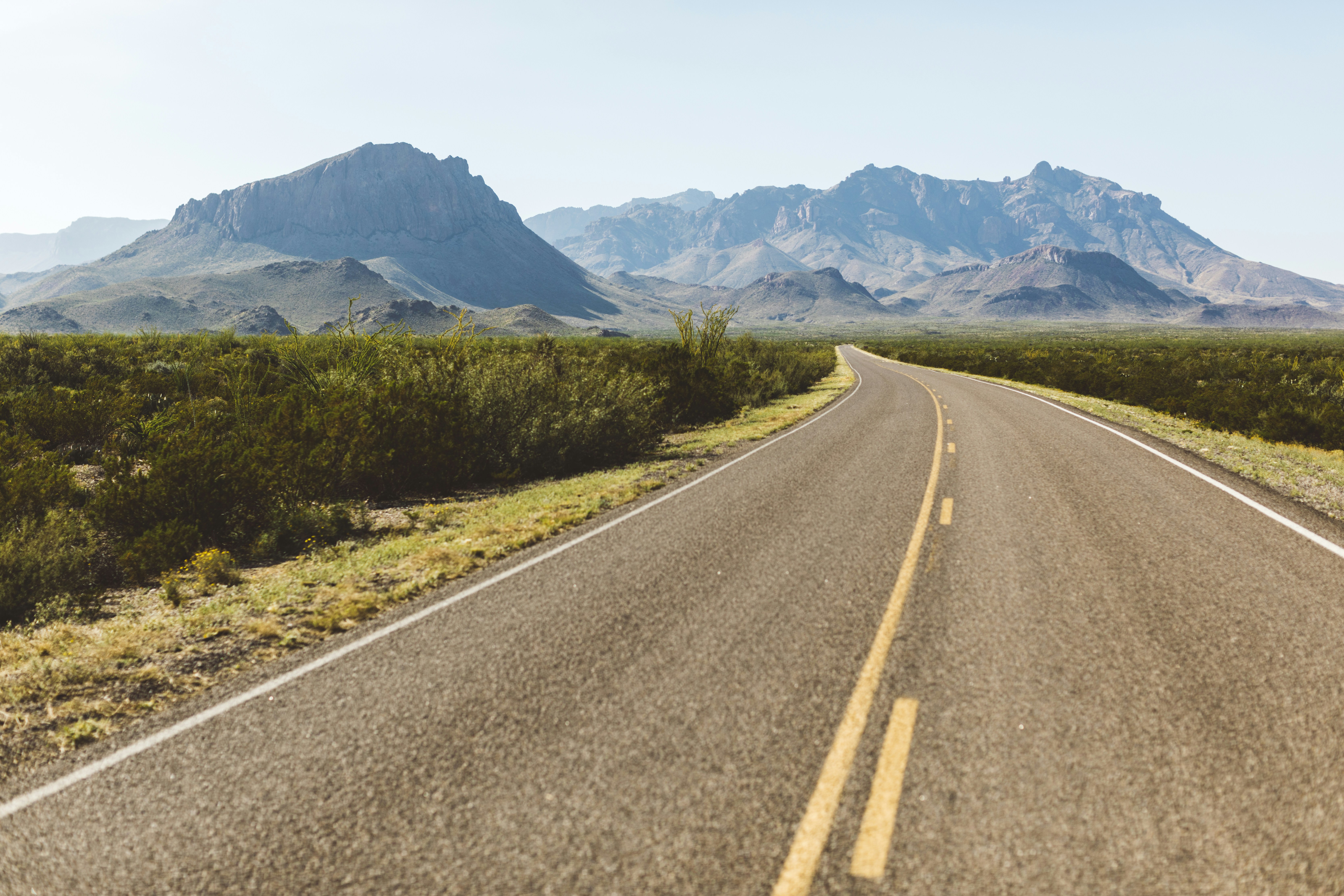 driving down a road in big bend national park towards the chisos mountains