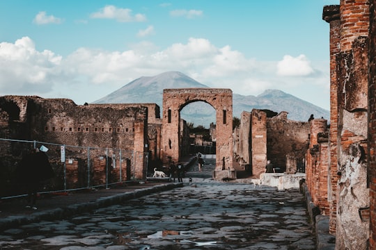 brown village arch during daytime in Forum at Pompeii Italy