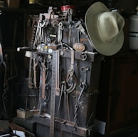 gray cowboy hat and mechanical tools