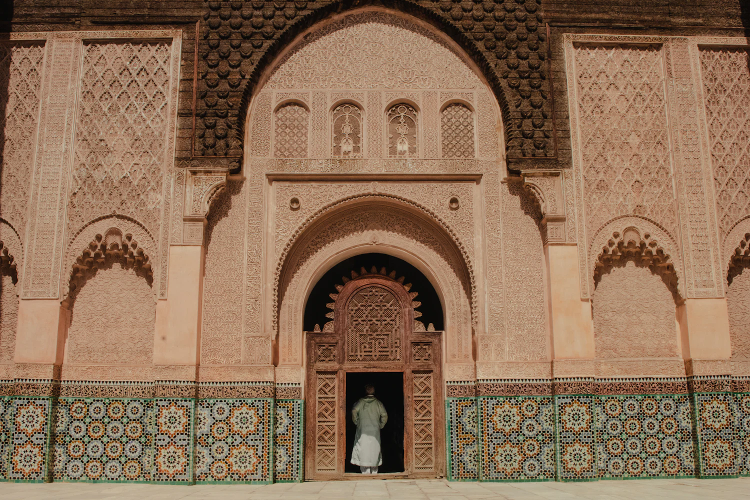 Traveller using a phone map in a Moroccan medina