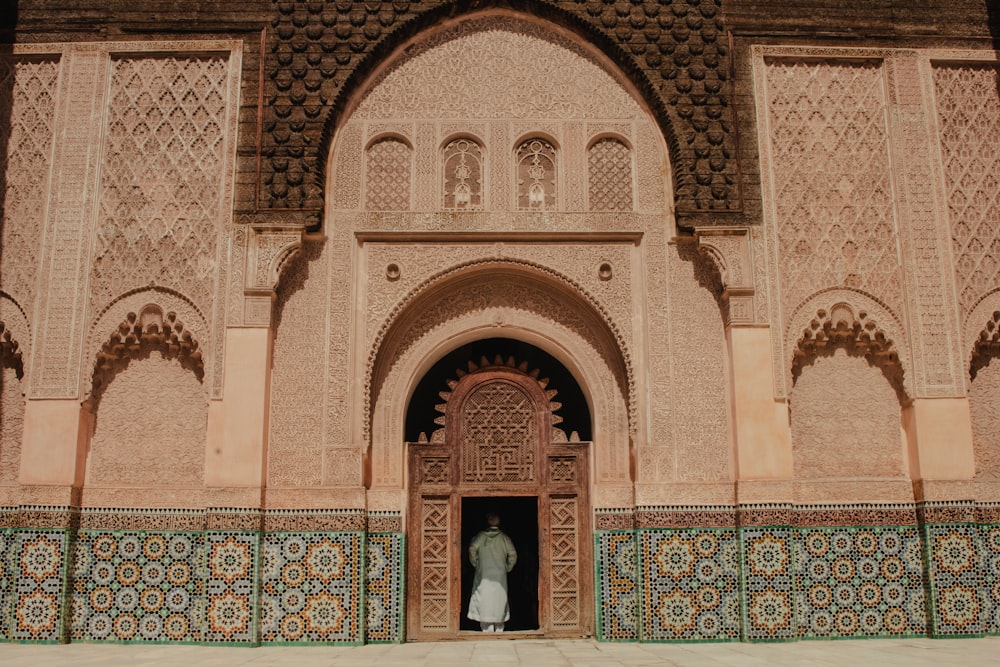 person standing on opened door of building