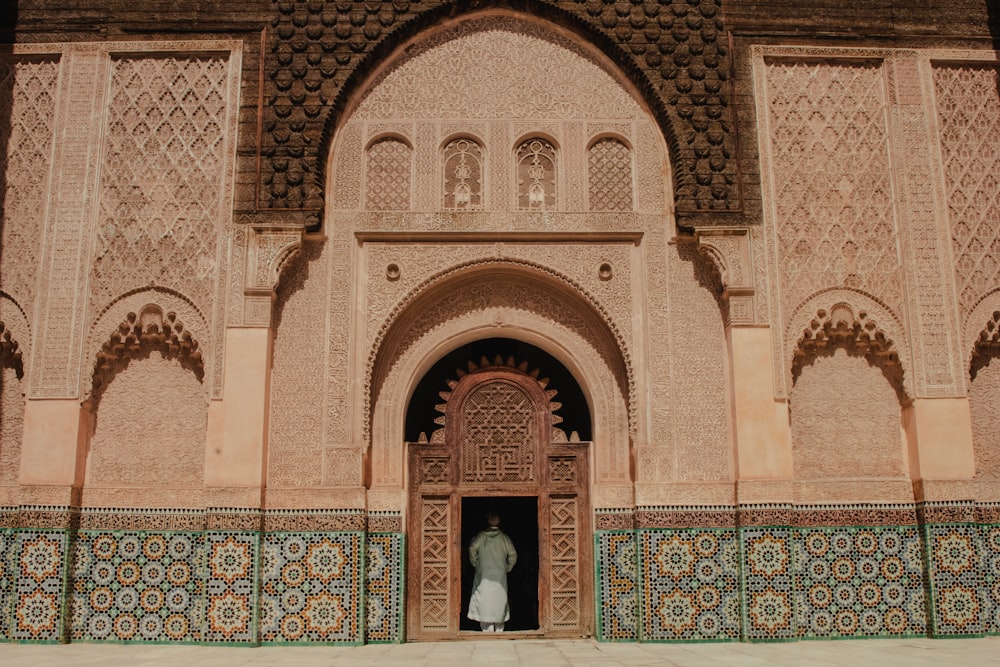 person standing on opened door of building