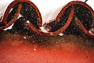 Close-up of clean roof tiles with water droplets sparkling after a thorough cleaning.