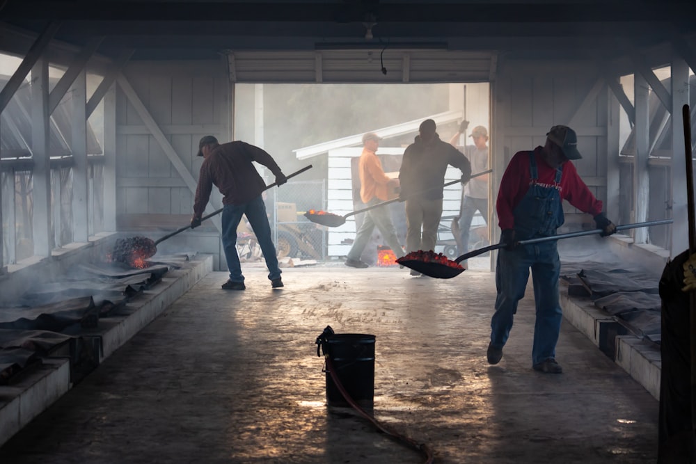 group of people lifting shovel