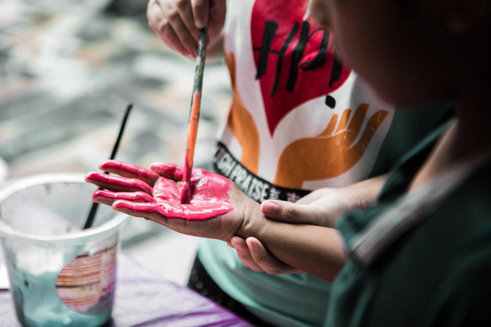 person holding paintbrush