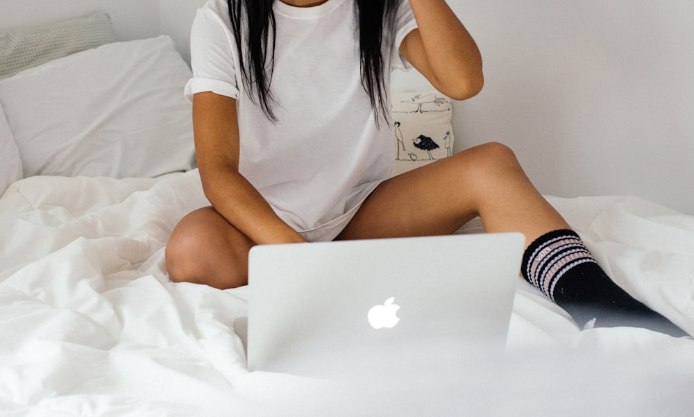 woman sitting on bed