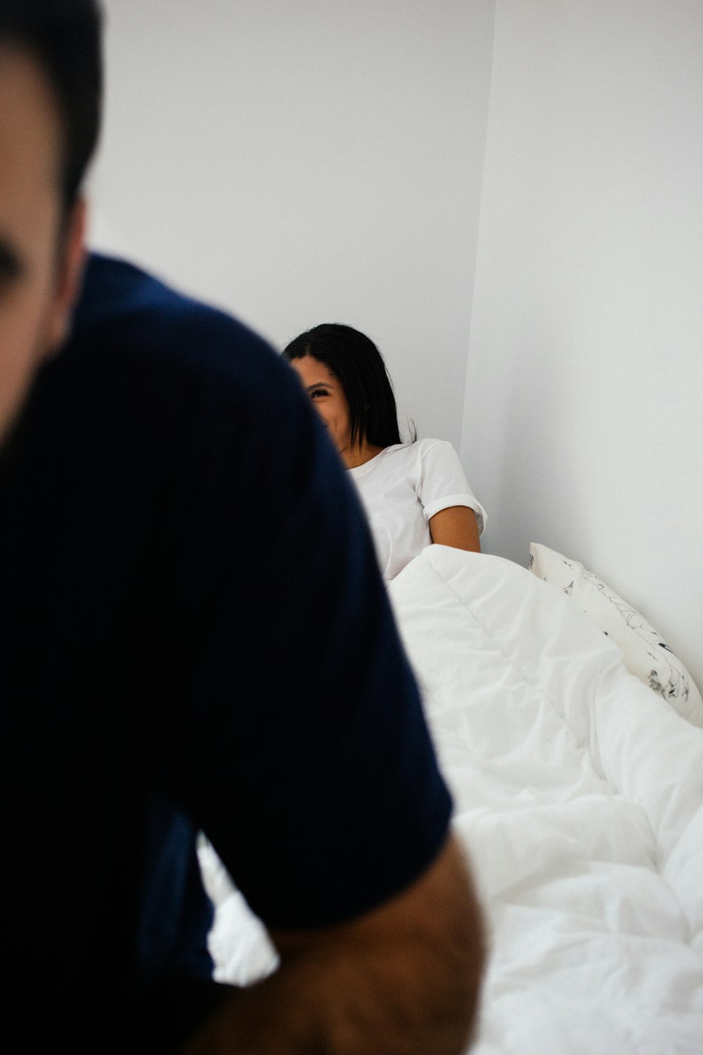 woman lying on bed in room