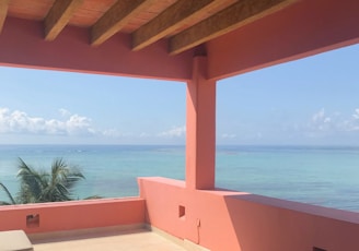 Cozy beachfront rental home with sunlit terrace and ocean view