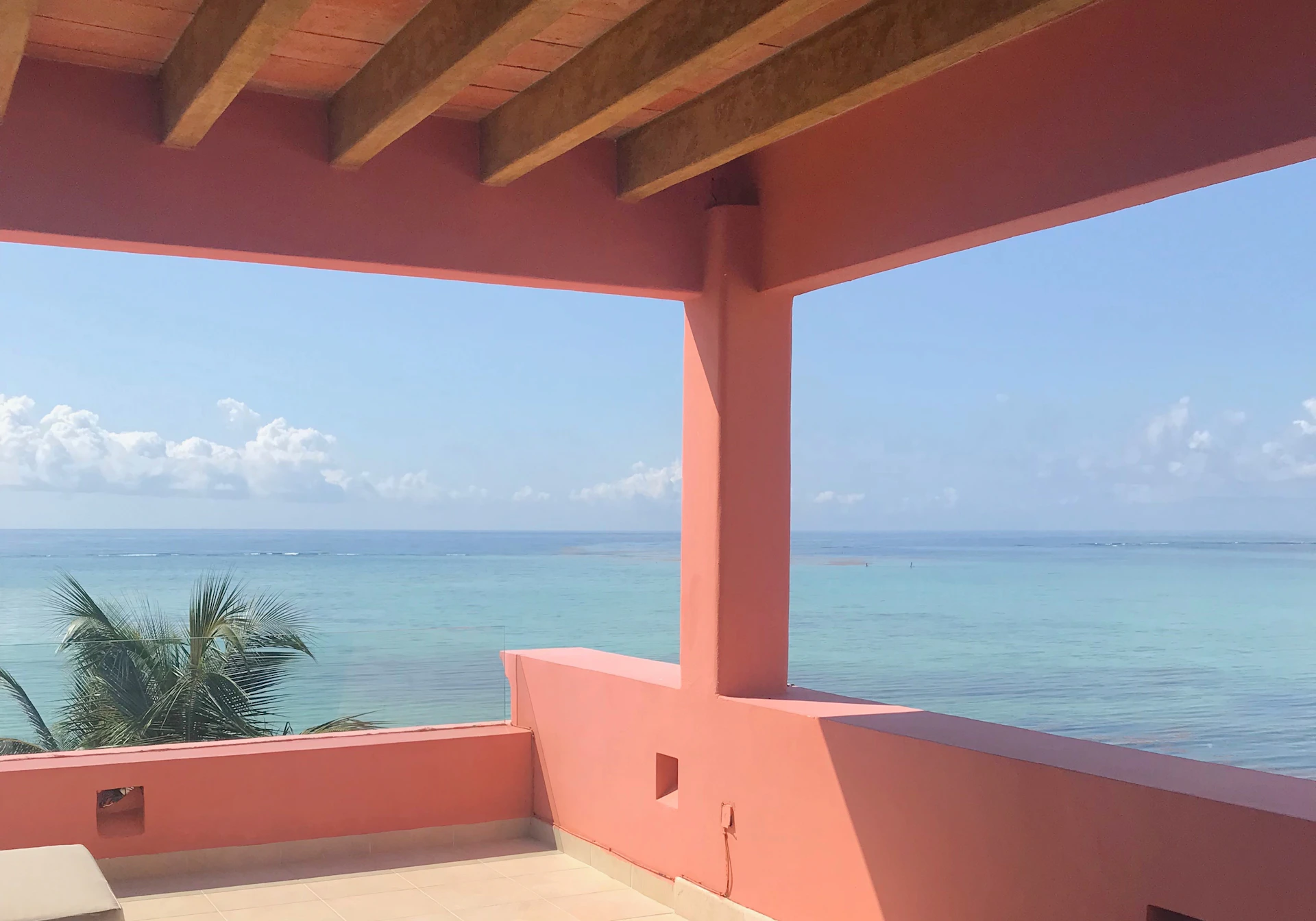 Tranquil ocean horizon seen from a private balcony, inviting peaceful moments in a luxury coastal retreat.