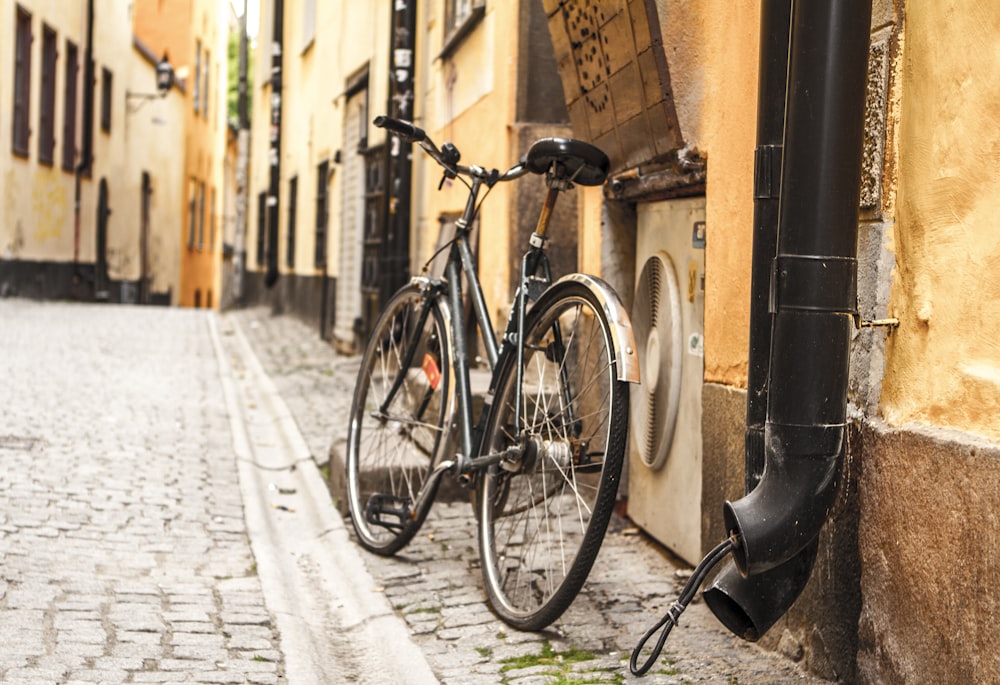 city bike parked at air condenser