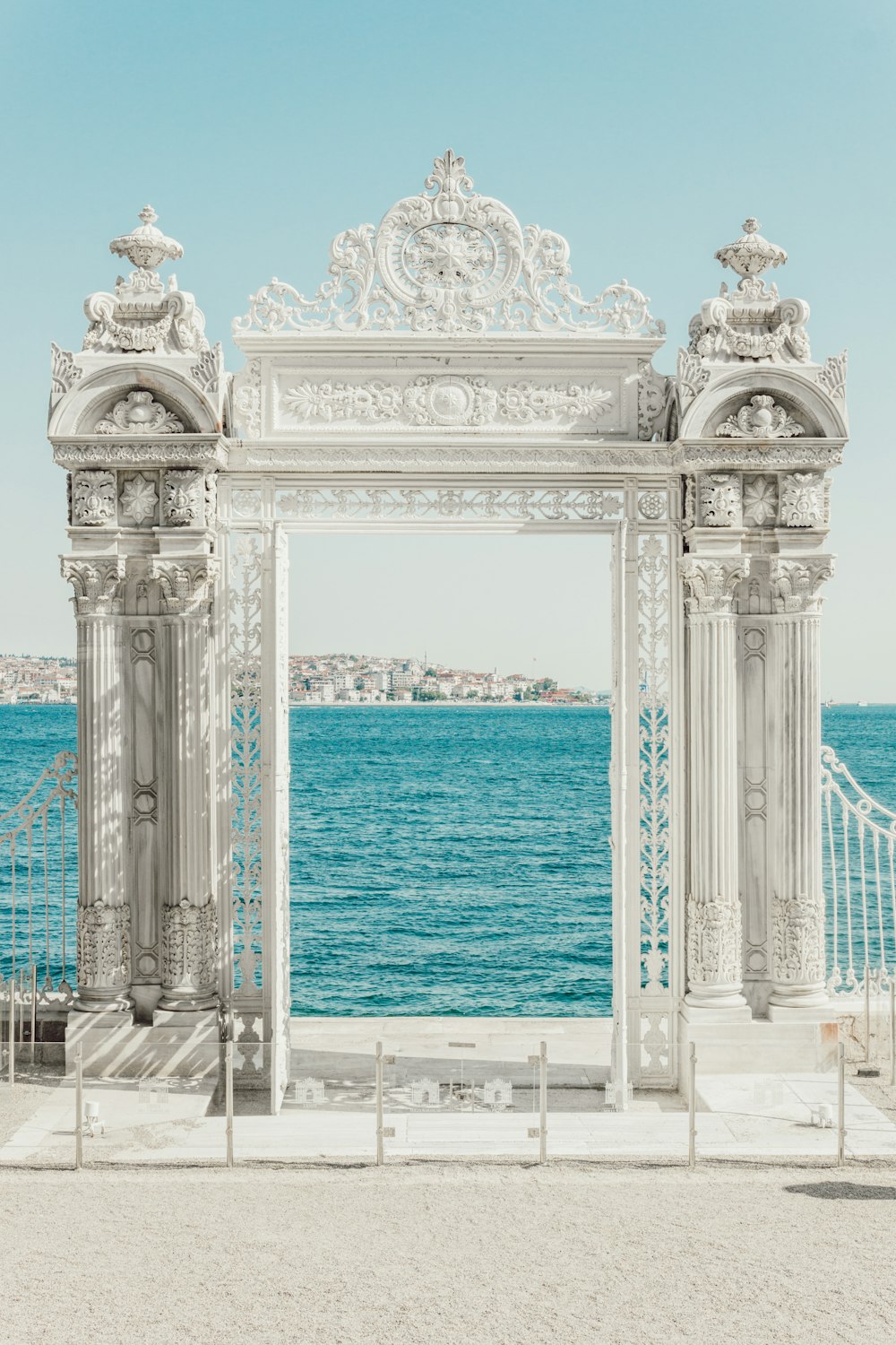 gray pillars near body of water