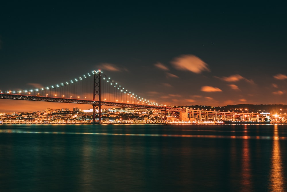 bridge over body of water during night