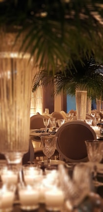 Elegant dining area set for a candlelit dinner overlooking the palace gardens.