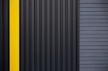 a black and yellow door with a yellow stripe