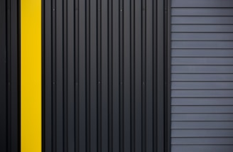 a black and yellow door with a yellow stripe