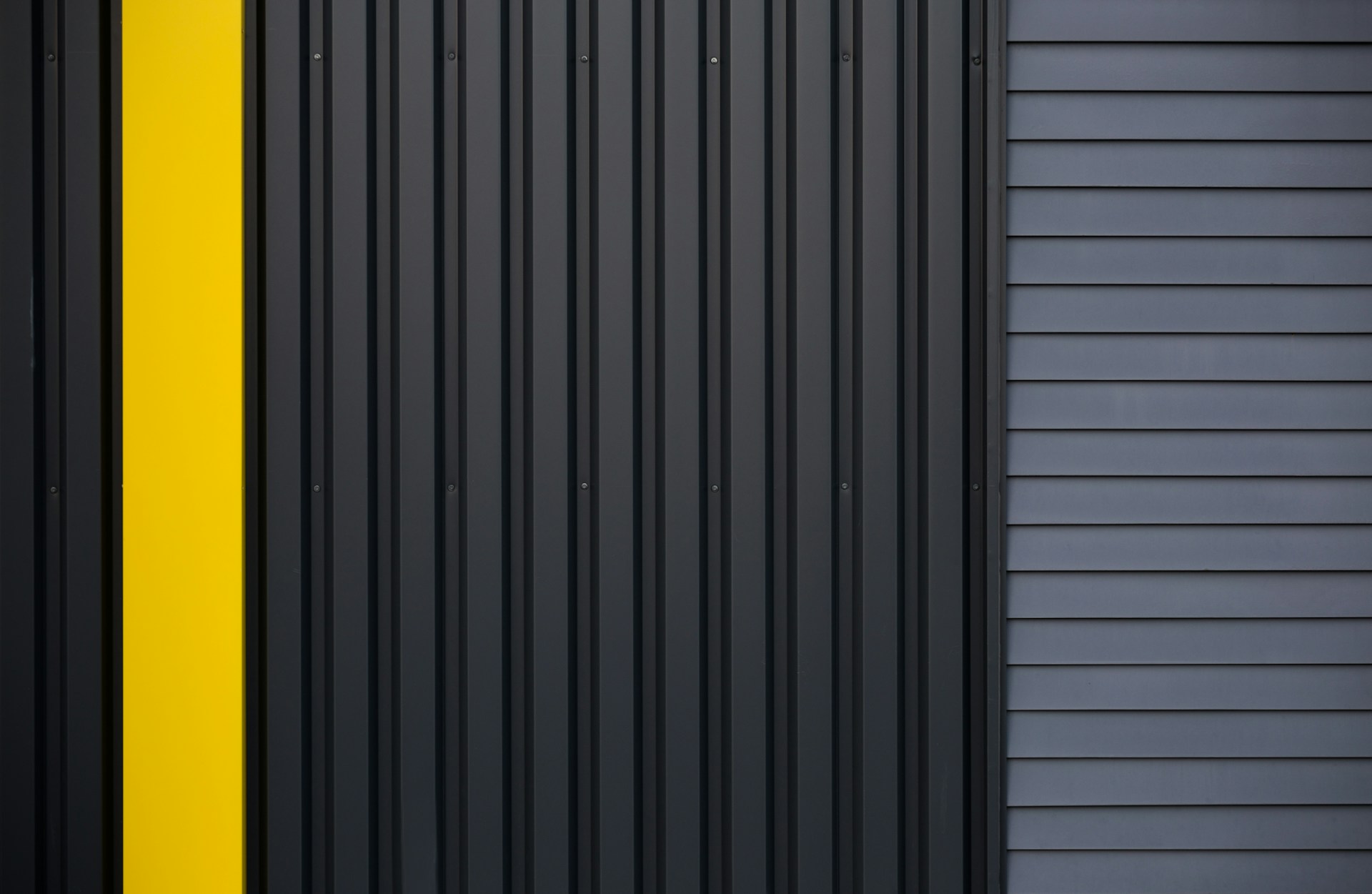 a black and yellow door with a yellow stripe