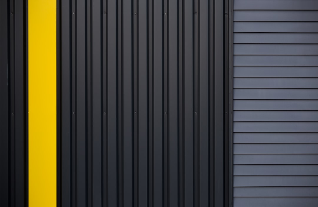 A black and yellow door with a yellow stripe