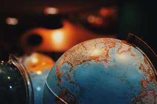 selective focus photo of terrestrial desk globe