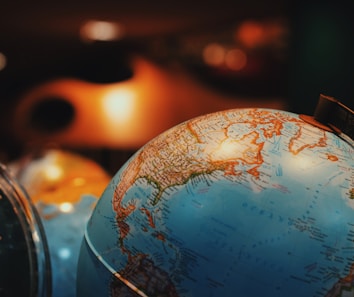 selective focus photo of terrestrial desk globe