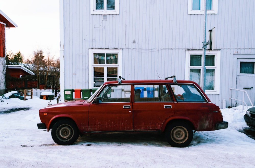 red station wagon on white snow