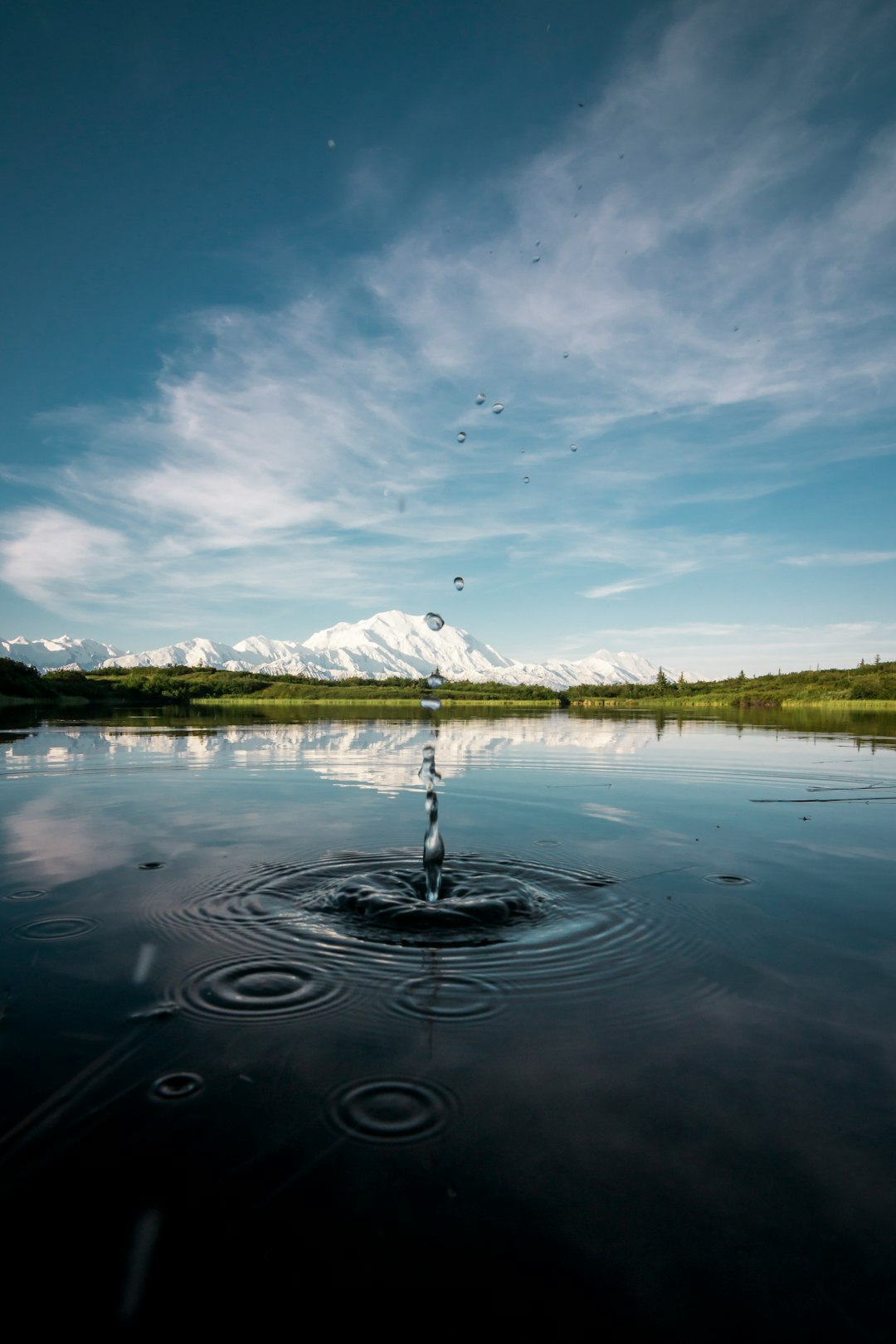 landmark photography of body of water with mountains