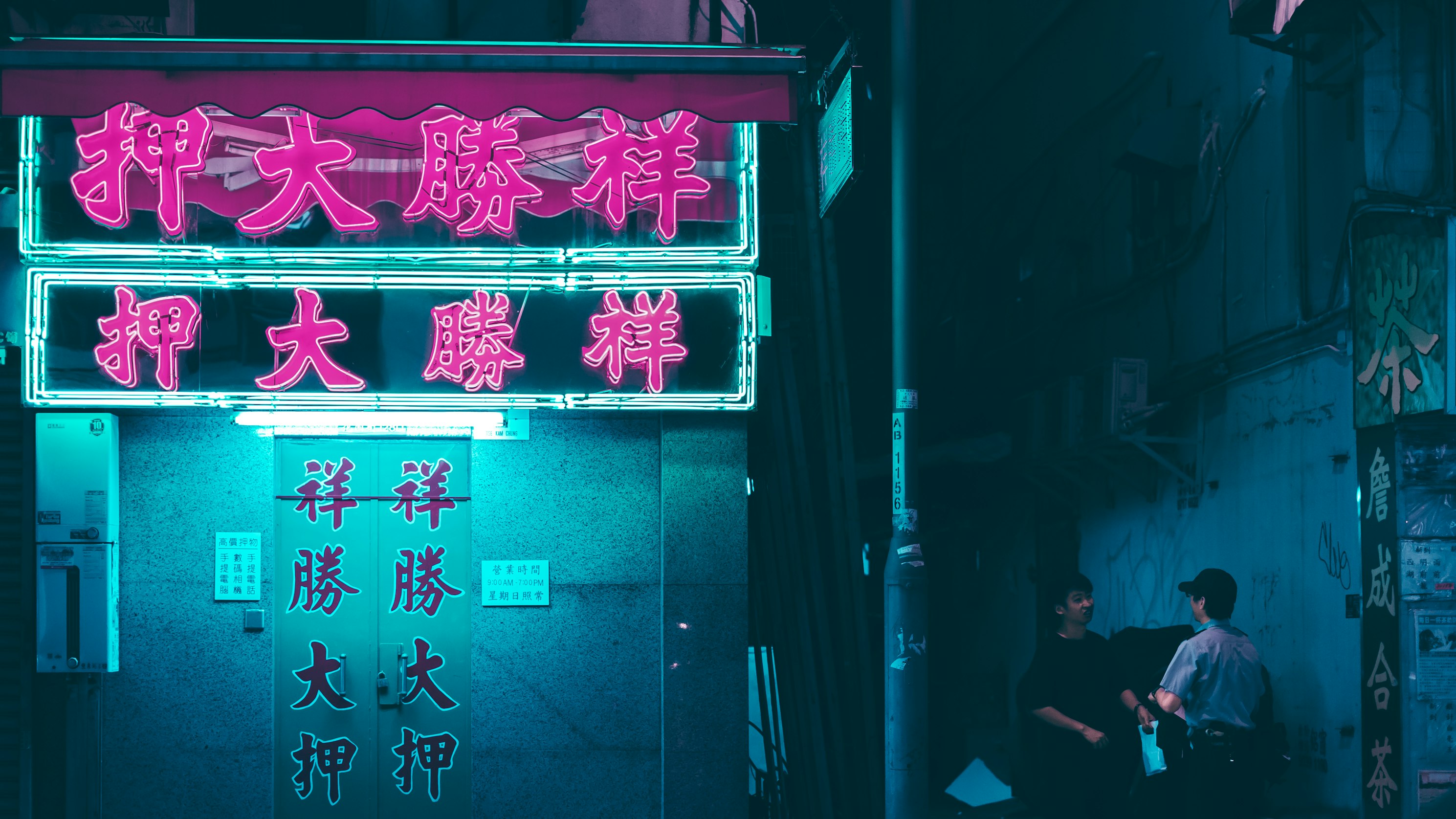 A guy being questioned by a police officer in Hong Kong (Sean Foley via Unsplash)
