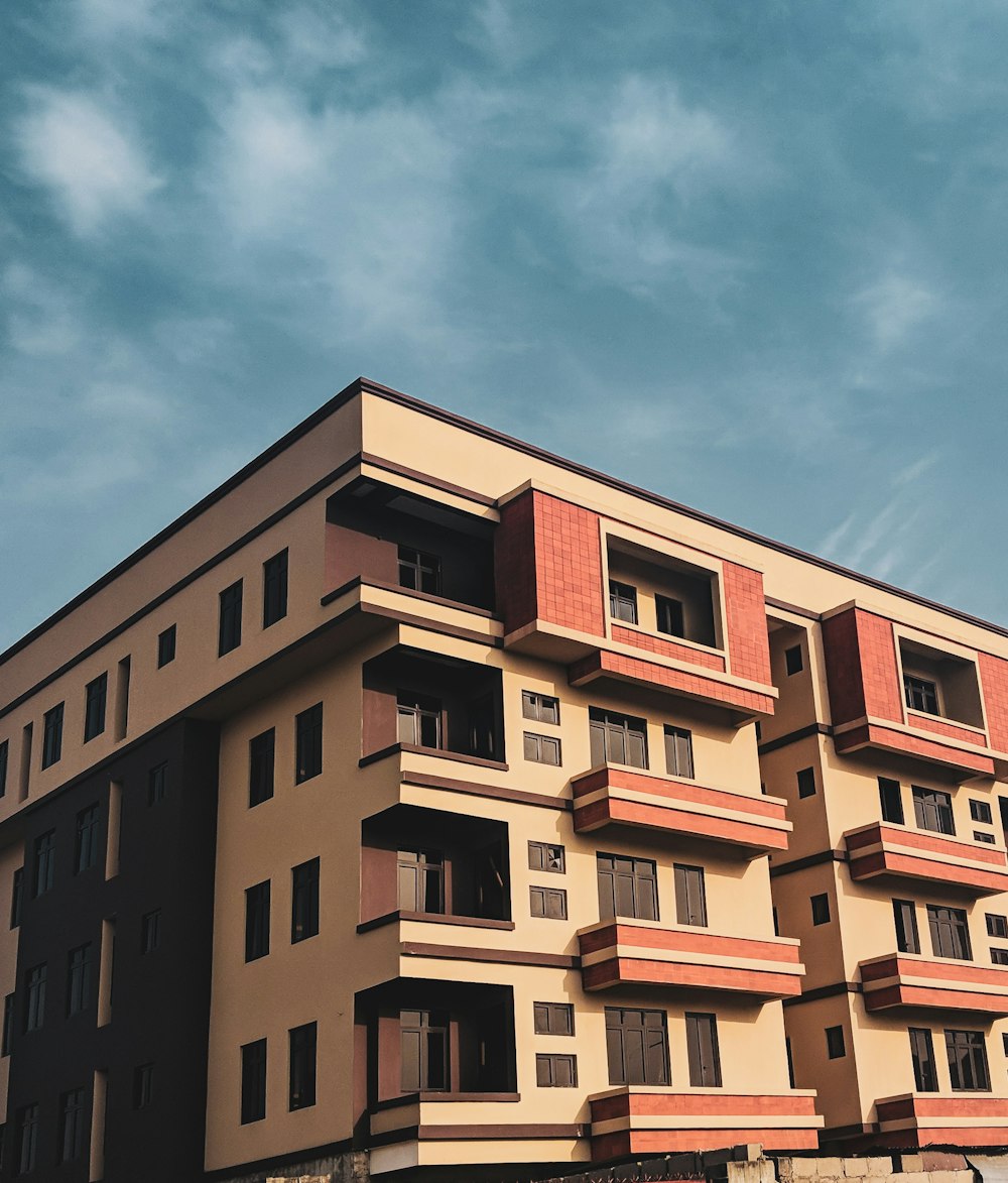 beige and brown concrete house under blue sky