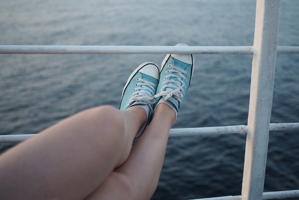 woman wearing low-top sneakers