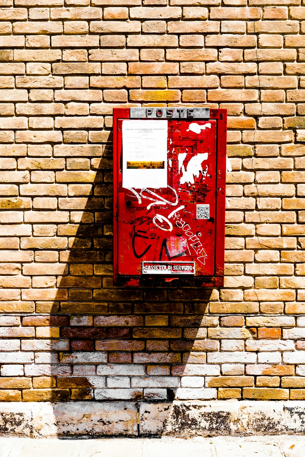 rectangular wall-mounted red metal case