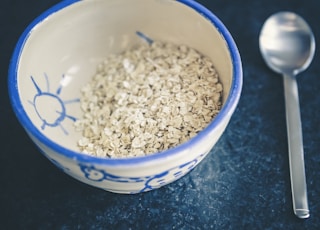 cereals in blue and white ceramic bowl