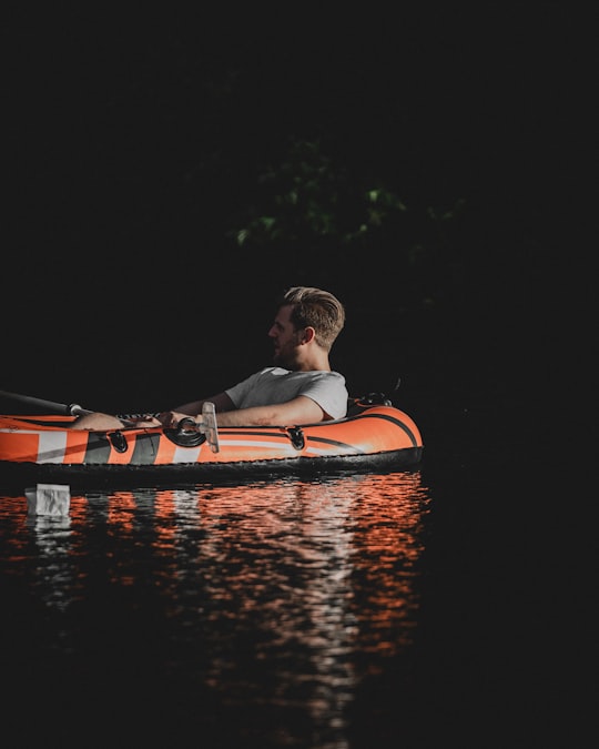 man sitting on inflatable raft in Utrecht Netherlands