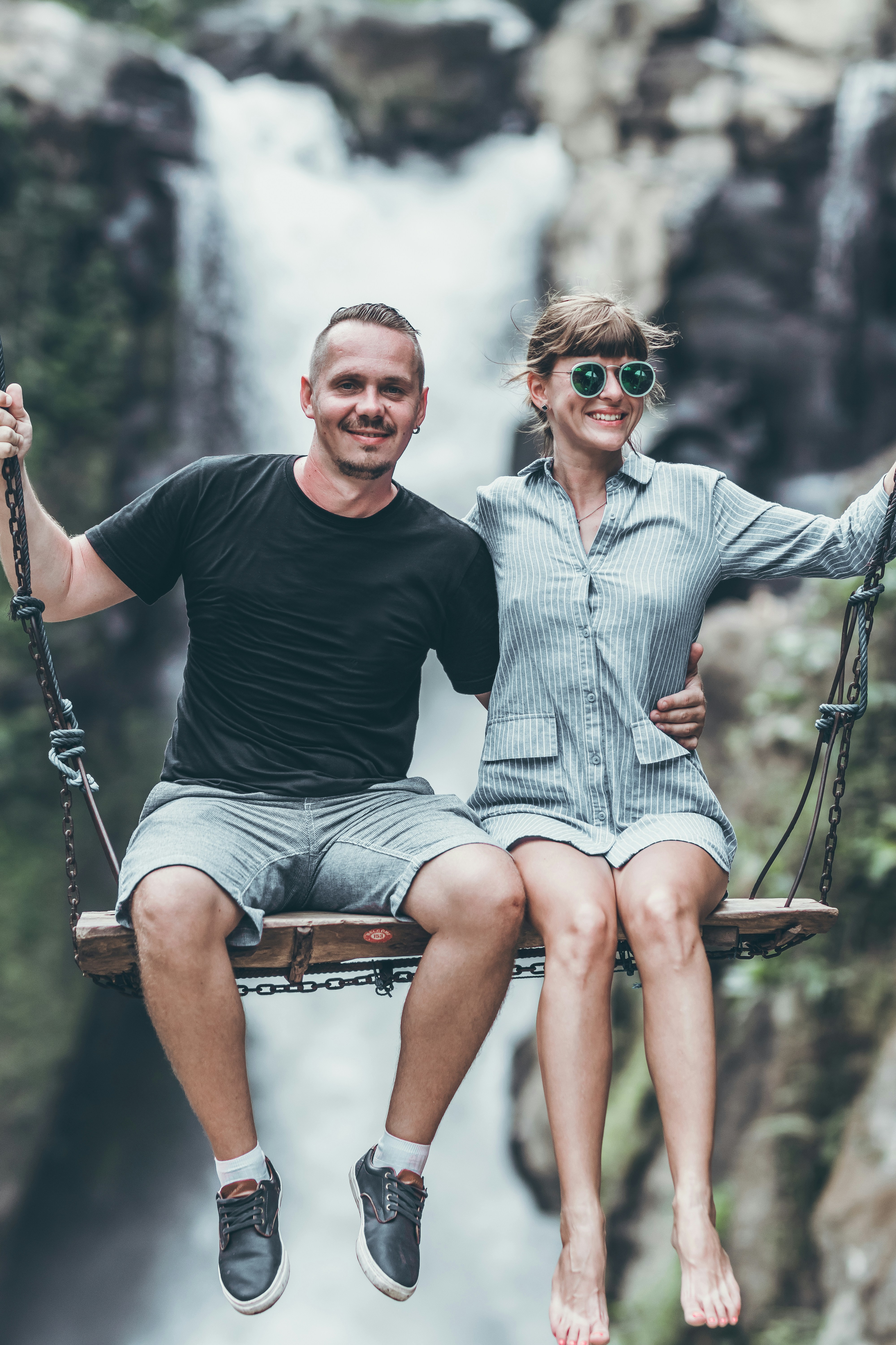A couple in Bali swing