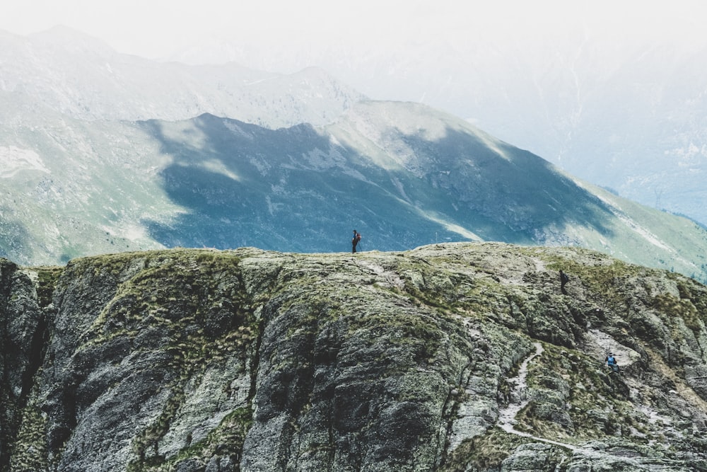 person standing on hill