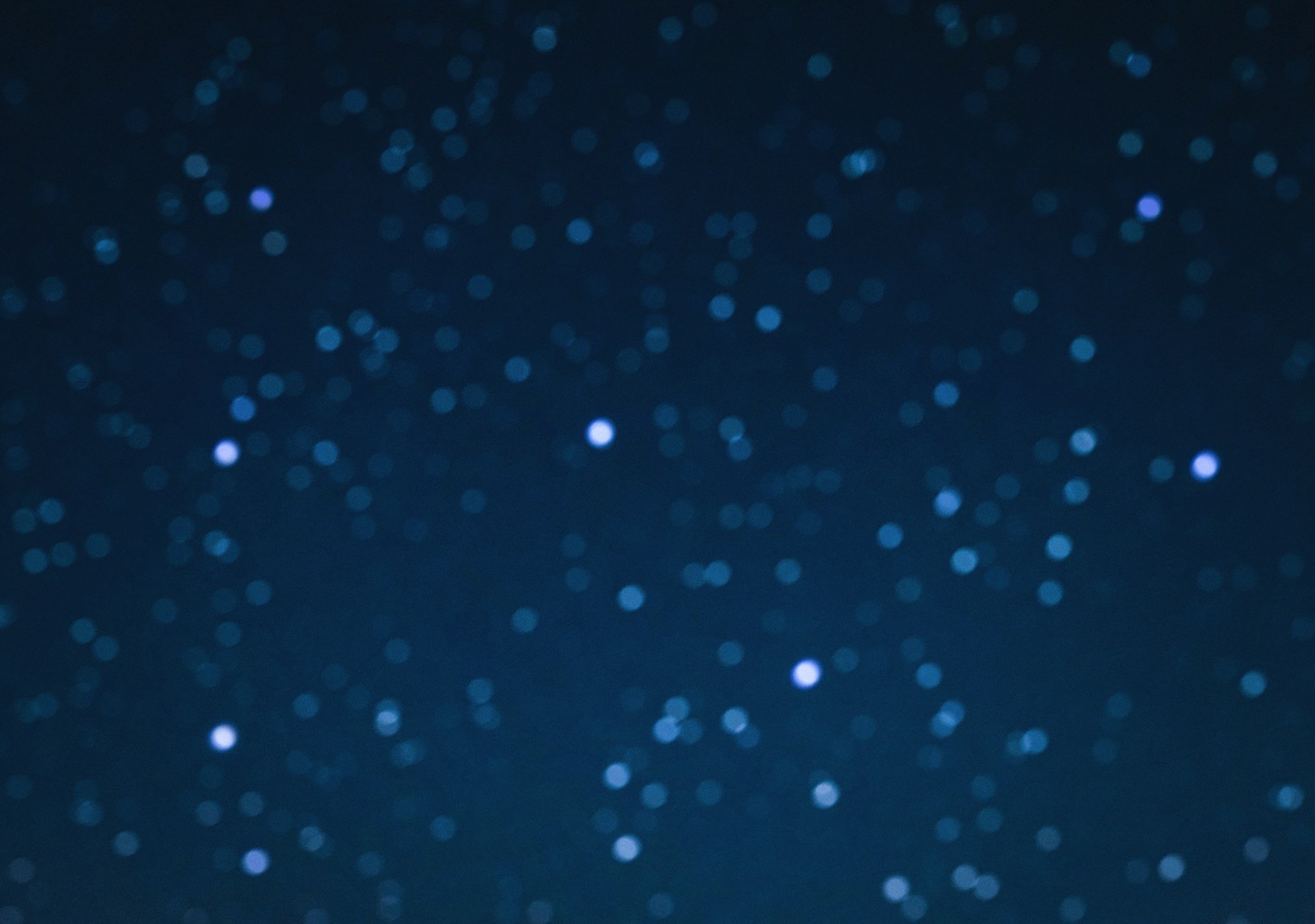 a blurry photo of a night sky with stars