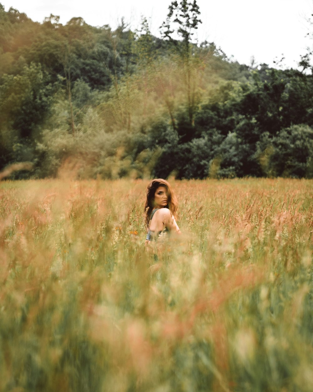 woman surrounded by plants