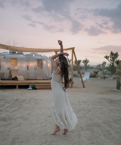 woman raising her both arms