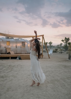 woman raising her both arms