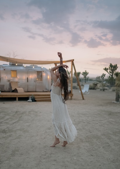 woman raising her both arms