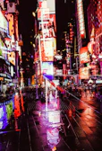 High-tech urban street illuminated by neon signs and digital billboards in cyberpunk style.