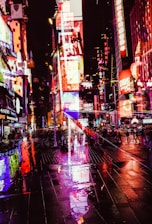 A sleek, dark-themed digital billboard glowing with neon accents in a bustling urban night scene.