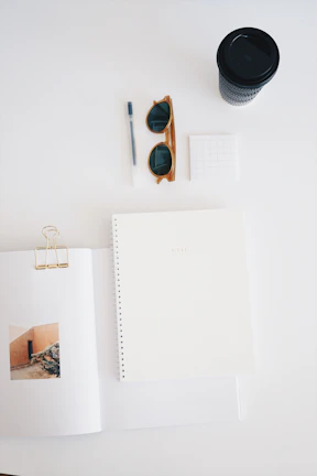 Minimalist flat lay of Japanese study tools: notebook, pen, flashcards with gentle natural light.