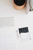 Apple wireless keyboard on white surface