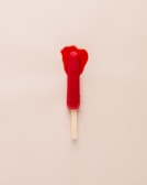 Bright pink paleta popsicles melting slightly on a sunny day.