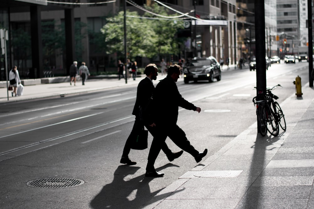 silhouette photography of man walking on road