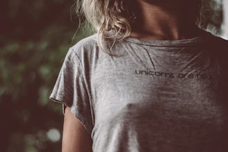 A lifestyle shot of a person wearing a subtle yet striking mythical character t-shirt, blending vintage vibes with modern style.
