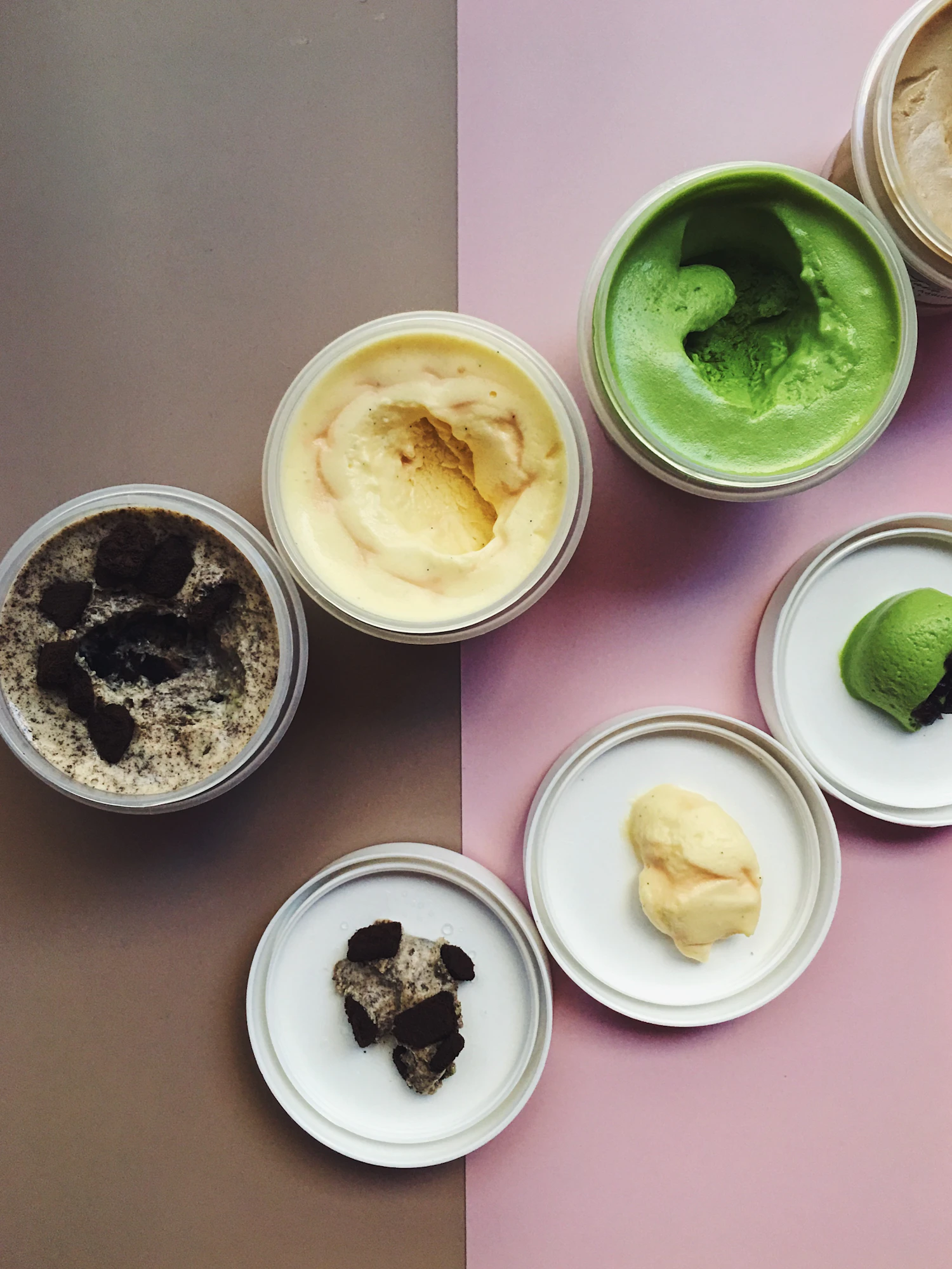 Six Scoopadoodle tubs photographed from above with their lids off, ready to be packed