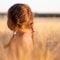 girl wearing pink camisole on brown plant during daytime