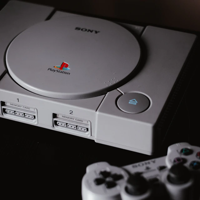 Closed original Sony PlayStation console with a DualShock controller