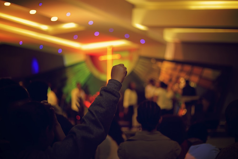 person raising fist in air