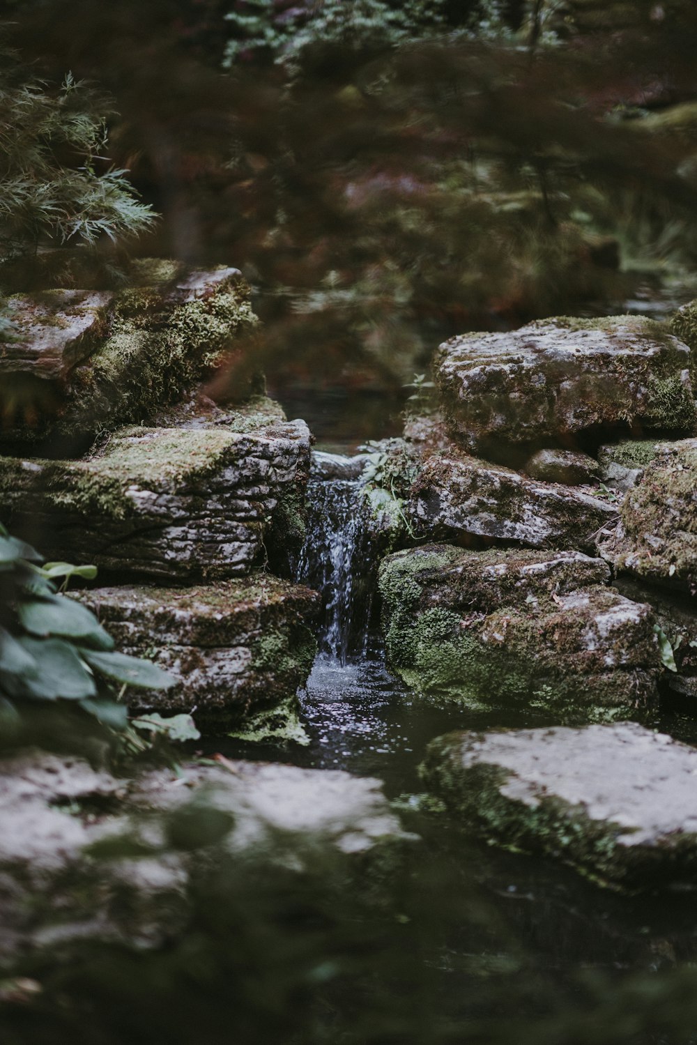 waterfalls surrounded with rock formations